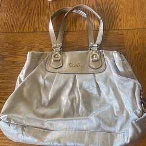 Rose gold and cream Coach purse